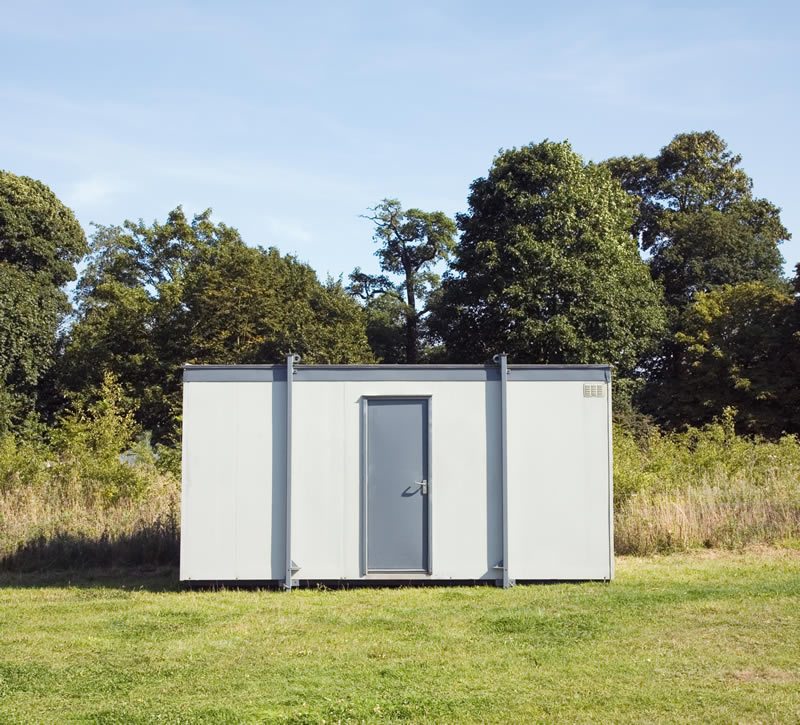 Portable office building in field